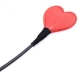 Black leather whip with red heart