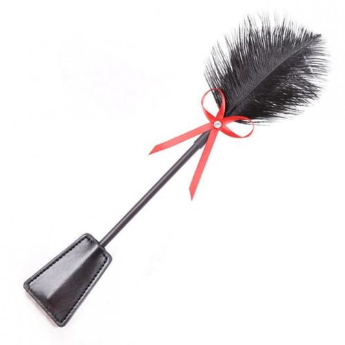 Tickle, black feather and leather, red ribbon