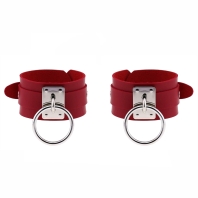 Leather red handcuffs, buckle and circles of silver color