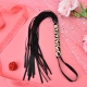 BDSM leather black whip, straps and handle with leopard pattern